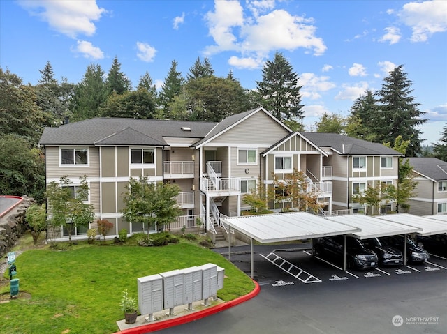 view of front facade with a front lawn and a carport