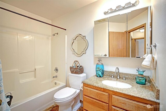 full bathroom featuring shower / tub combo, vanity, and toilet