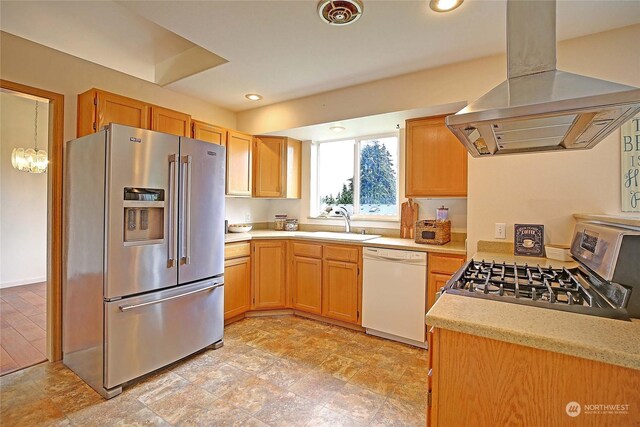 kitchen featuring island range hood, appliances with stainless steel finishes, and sink