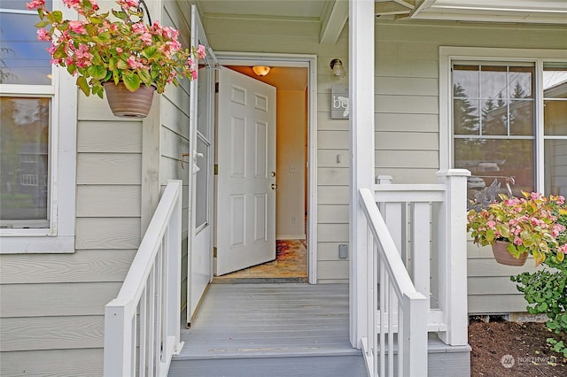 view of exterior entry featuring a porch