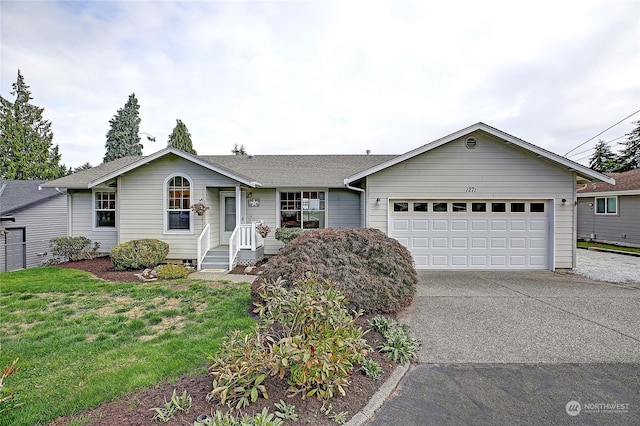 ranch-style house with a front yard and a garage