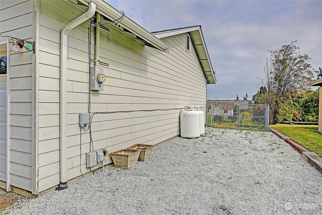 view of side of property with a patio area