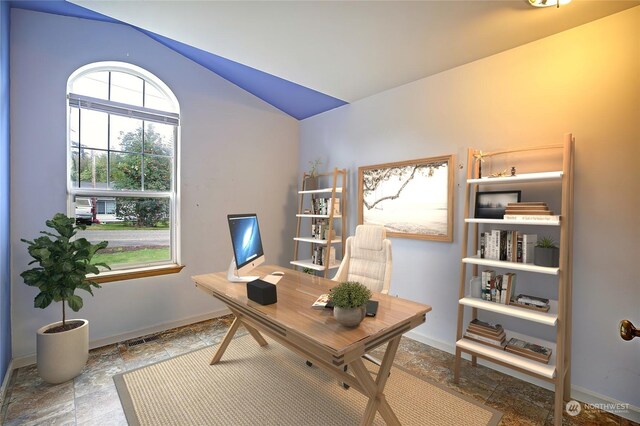 office area featuring lofted ceiling