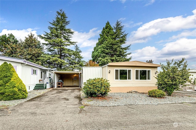 view of front of property with a carport