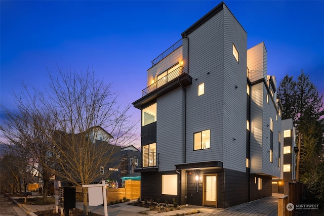 view of property exterior at dusk