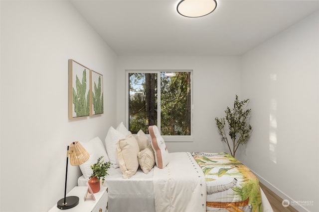 bedroom with hardwood / wood-style floors