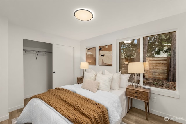 bedroom featuring a closet and light hardwood / wood-style flooring