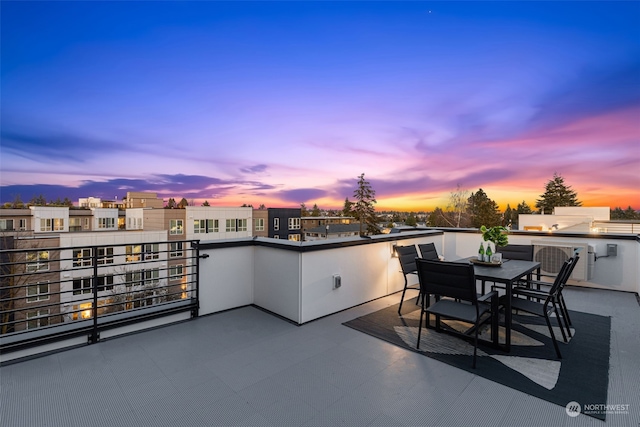 patio terrace at dusk with a balcony