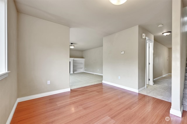 spare room with wood-type flooring