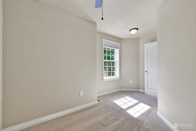 carpeted empty room with ceiling fan