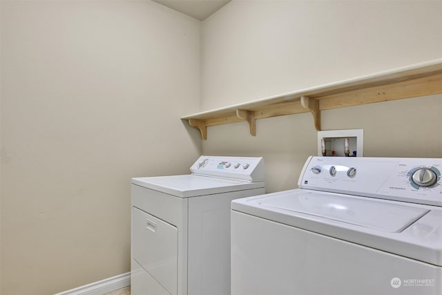 laundry room with washing machine and clothes dryer