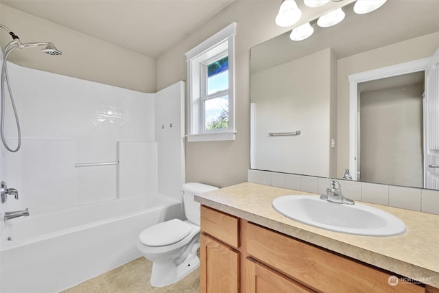 full bathroom featuring tile patterned flooring, vanity, toilet, and washtub / shower combination