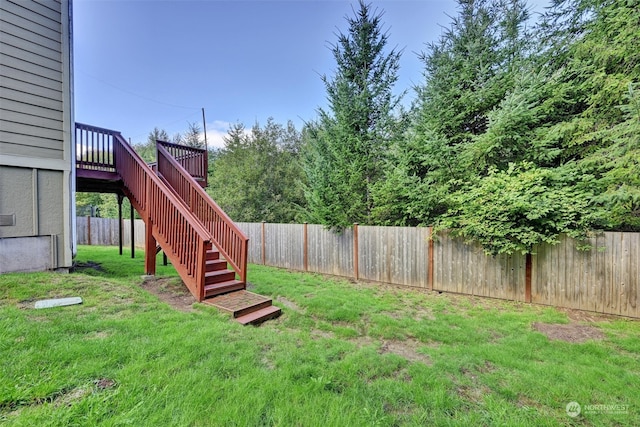 view of yard featuring a wooden deck