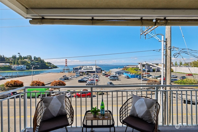 balcony featuring a water view