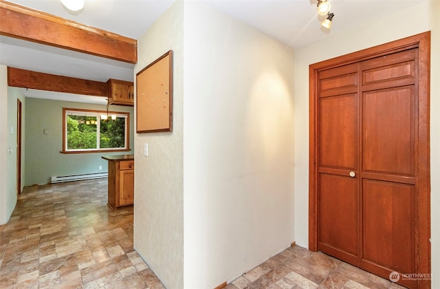 hallway with a baseboard heating unit