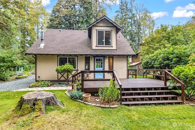 rear view of house with a lawn