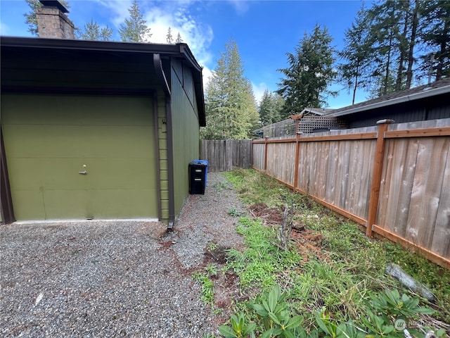 exterior space featuring fence and driveway