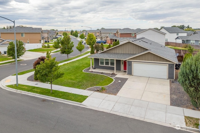 craftsman-style house featuring a front yard and a garage