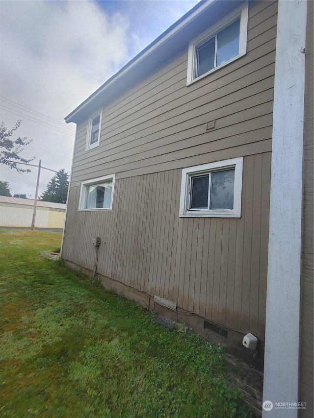 view of home's exterior featuring a yard