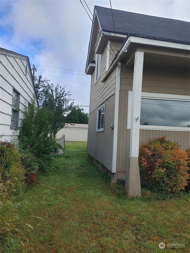 view of home's exterior with a yard