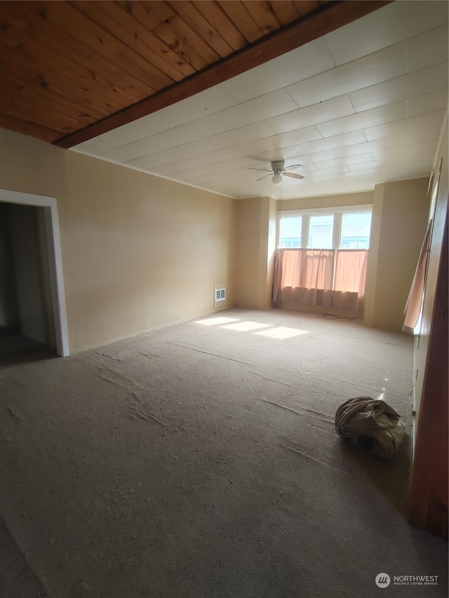 spare room featuring ceiling fan and carpet