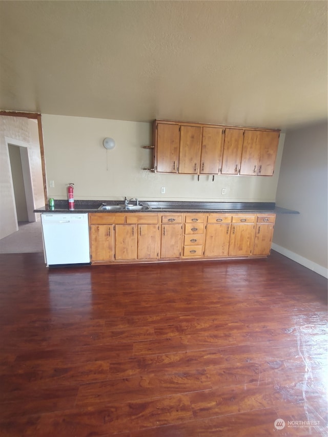 kitchen with dishwasher, dark hardwood / wood-style flooring, and sink