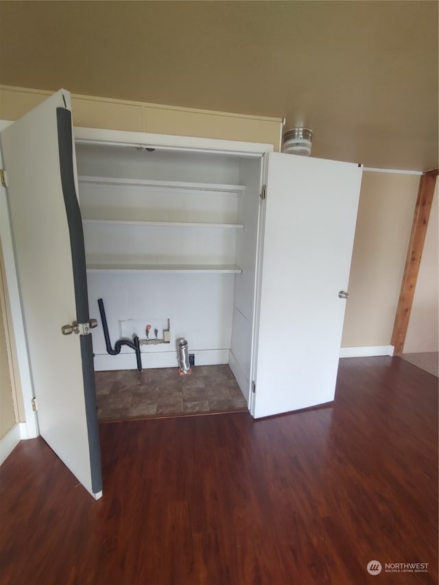 washroom with washer hookup and dark hardwood / wood-style flooring