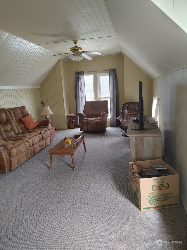 carpeted living room featuring ceiling fan and lofted ceiling