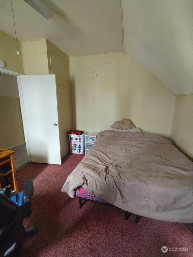 carpeted bedroom with lofted ceiling and ceiling fan