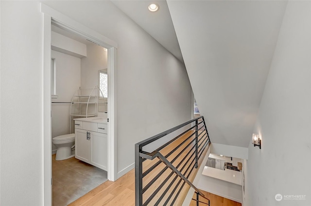 stairs featuring wood-type flooring