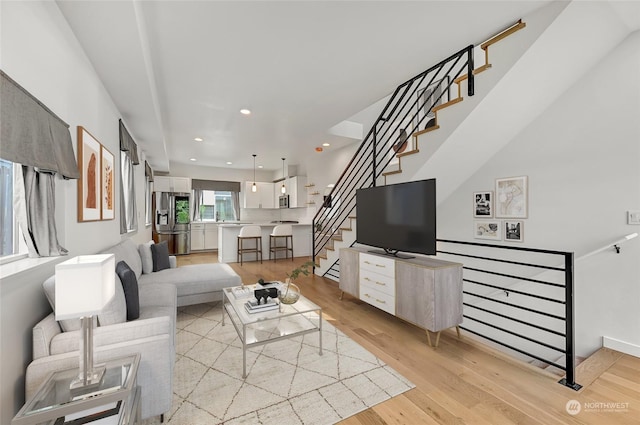 living room with light hardwood / wood-style flooring