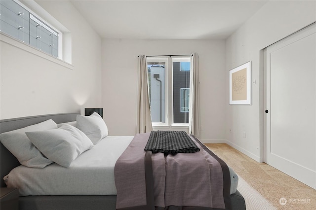 bedroom with light colored carpet