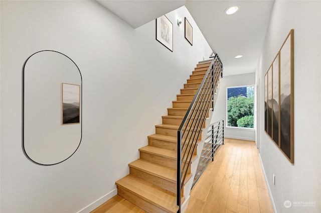 stairway with wood-type flooring