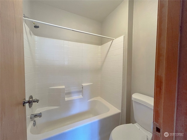 bathroom with toilet and tub / shower combination