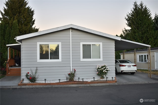 view of front of home featuring a carport