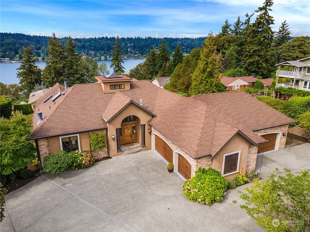 birds eye view of property with a water view