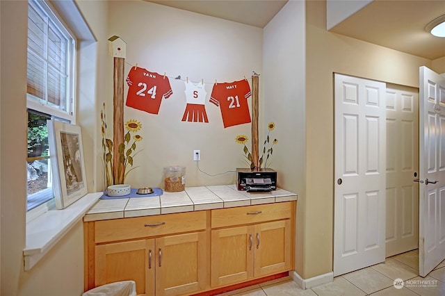 interior space featuring tile counters and light tile patterned floors