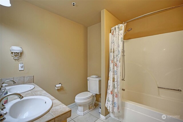 full bathroom with shower / bath combination with curtain, toilet, vanity, and tile patterned flooring