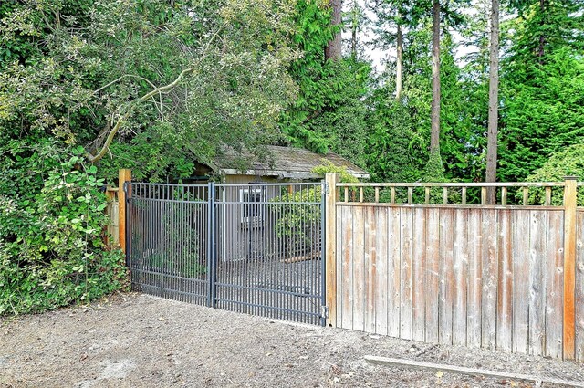 view of gate featuring fence