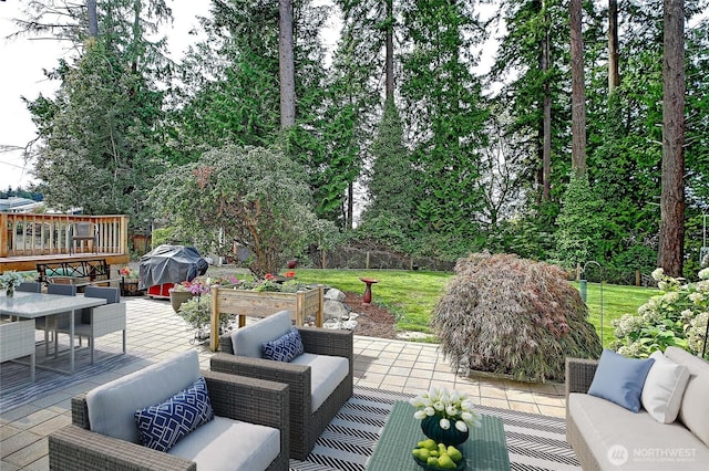 view of patio featuring outdoor dining space, a grill, an outdoor hangout area, and a deck