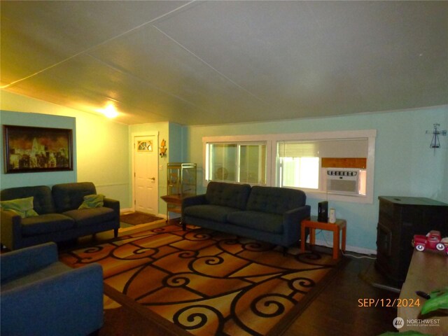 living room featuring vaulted ceiling and cooling unit