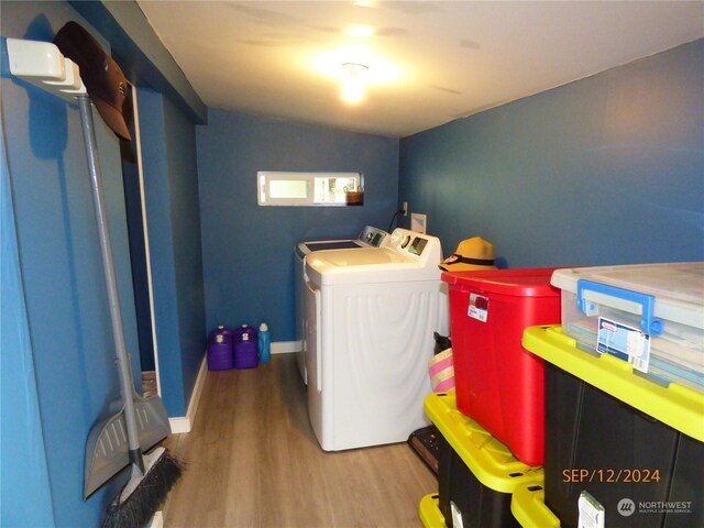 washroom featuring washer and dryer and hardwood / wood-style floors