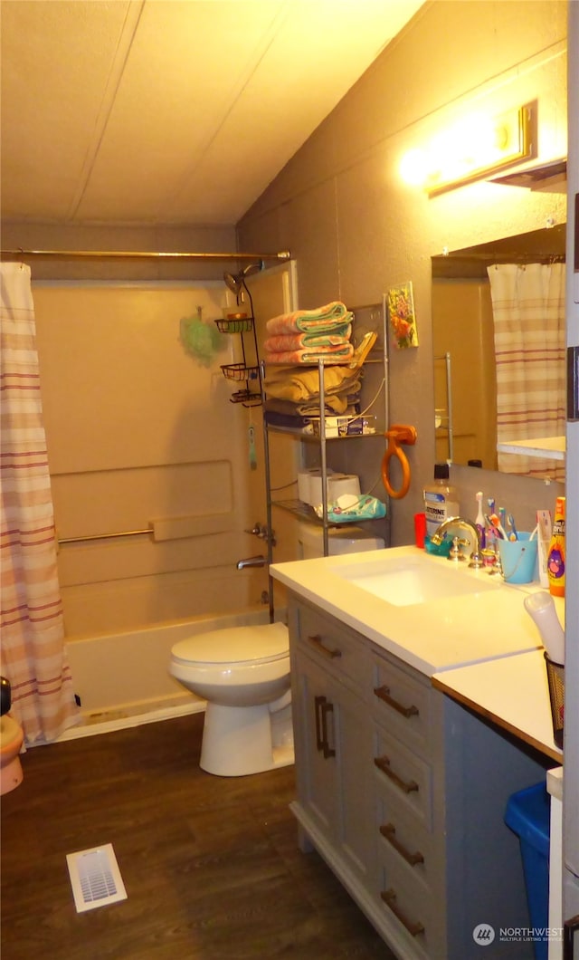 full bathroom featuring toilet, vanity, shower / tub combo, lofted ceiling, and hardwood / wood-style flooring