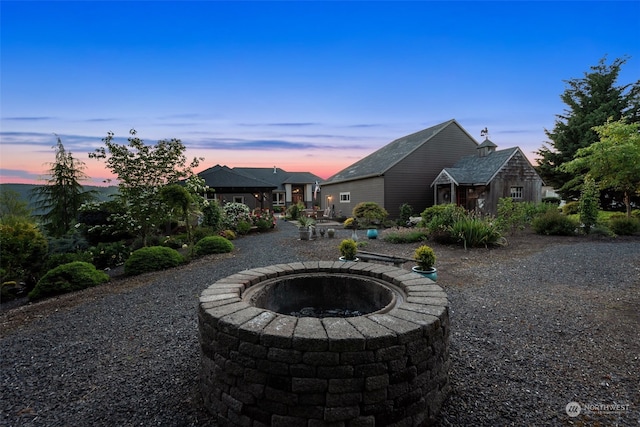 exterior space featuring an outdoor fire pit