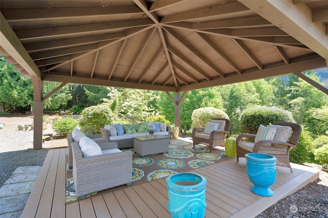 wooden deck with an outdoor hangout area and a gazebo