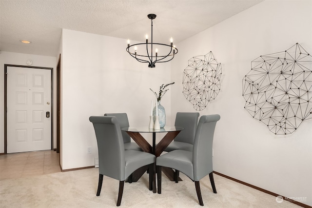 carpeted dining space featuring an inviting chandelier and a textured ceiling