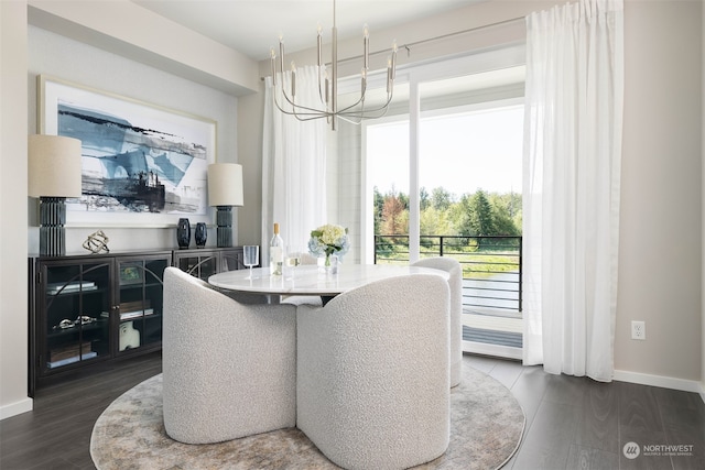 dining area featuring a notable chandelier and dark hardwood / wood-style flooring