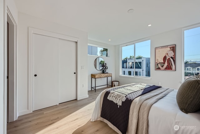 bedroom featuring a closet and light hardwood / wood-style floors