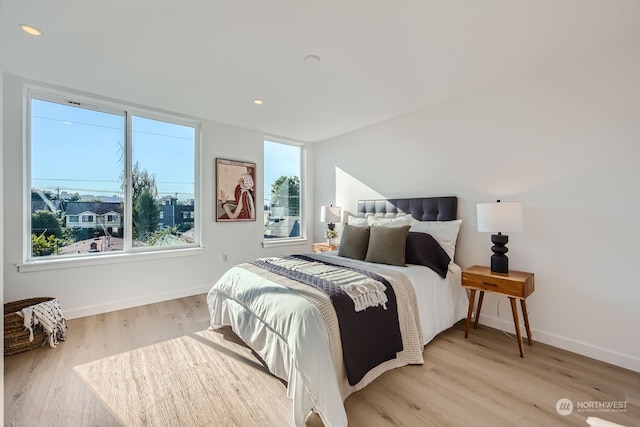 bedroom with light wood-type flooring