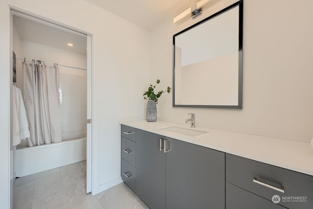 bathroom featuring shower / bath combo and vanity